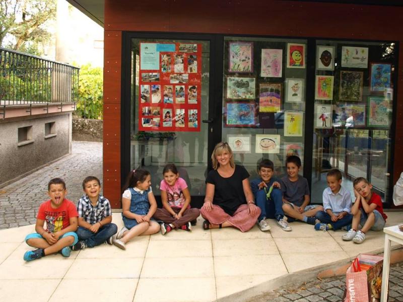kids in front of their art